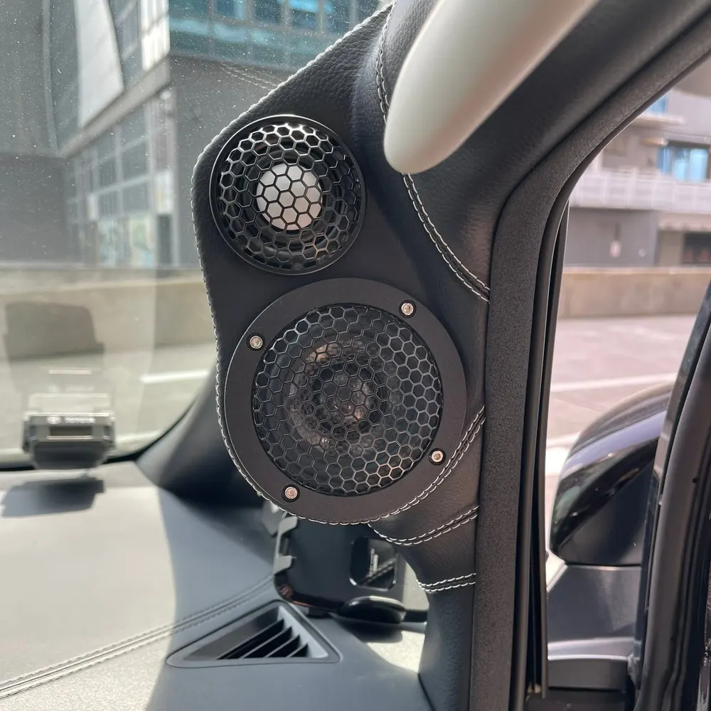 Custom leather-wrapped A-pillar pods with ETHOS tweeter and midrange installed in a Toyota